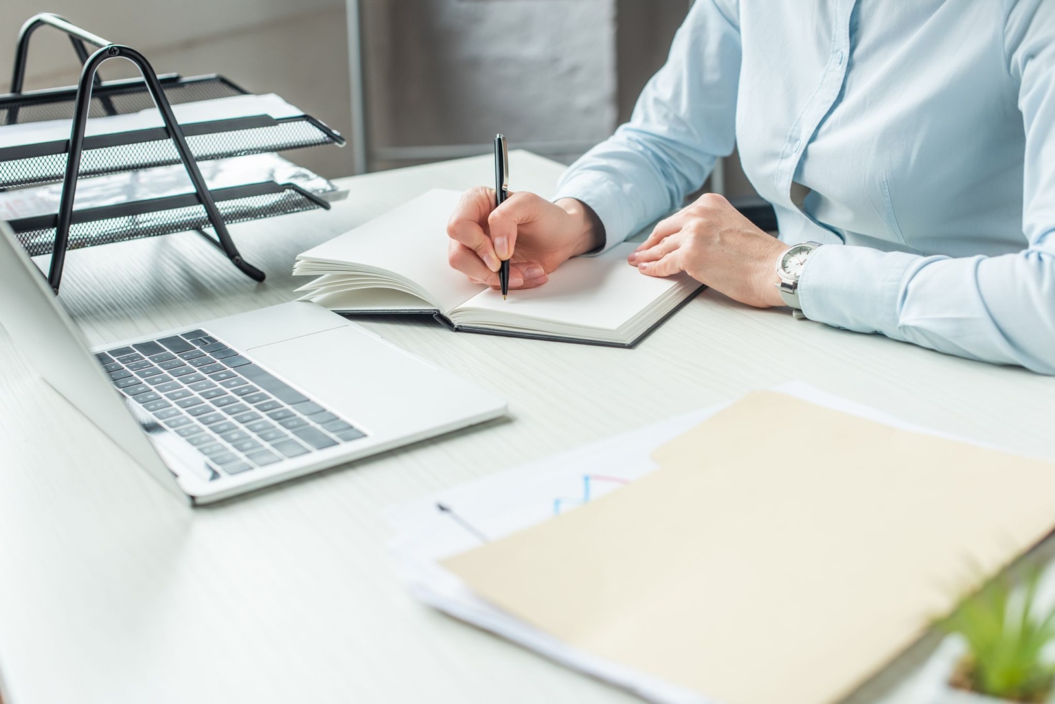 Estate planning lawyer working on laptop and notebook